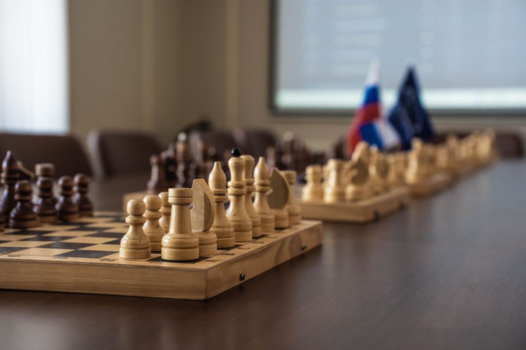 Chess board set up on a boardroom table